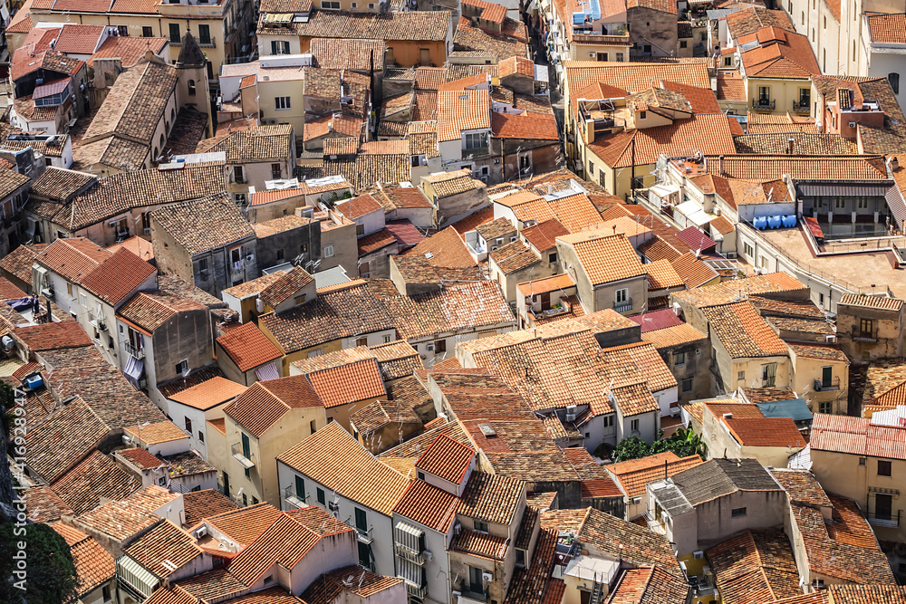 Panorama of Sicilian coastal medieval small city Cefalu (Cephaloedium) with turquoise Tyrrhenian Sea from Rocca Mountain. Province of Palermo, Cefalu, Sicily, Italy.