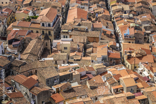 Panorama of Sicilian coastal medieval small city Cefalu (Cephaloedium) with turquoise Tyrrhenian Sea from Rocca Mountain. Province of Palermo, Cefalu, Sicily, Italy. photo