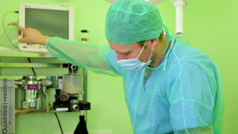 Male nurse working at ICU during the Coronavirus pandemic. High quality 4k footage Male nurse working at ICU during the Coronavirus pandemic. High quality 4k footage