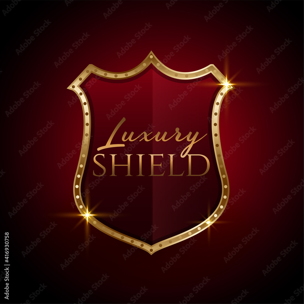 luxury golden shield symbol design in red colors