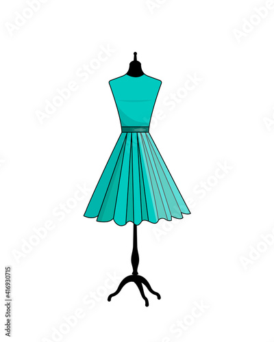 A female mannequin in a green dress is isolated on a white background.