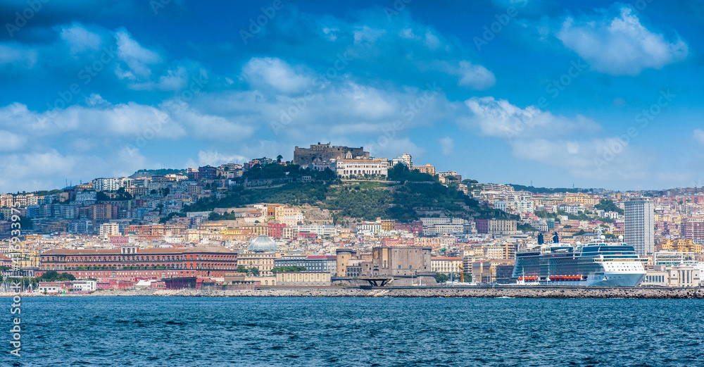Panoramic view of Naples and the port from the sea, white cruise line
