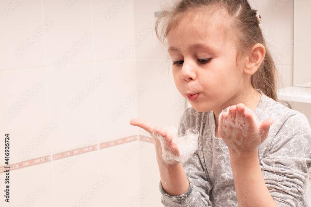 child washing hands and showing soapy palms Stock Photo Adobe Stock