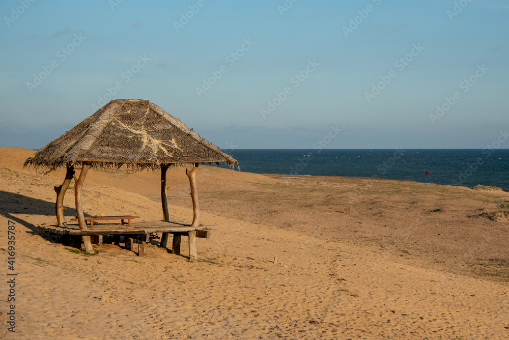 Sri Lankan beach with shade house.