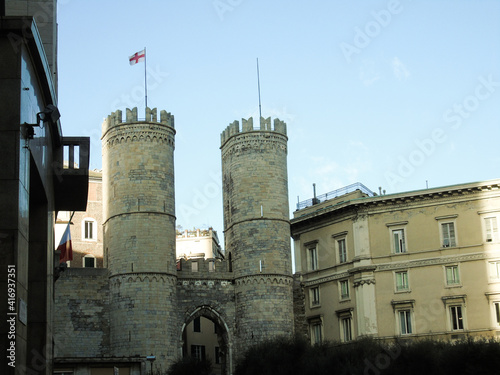 Genova, Italy - February 26, 2021: Editing some old photos of the city of Genova from home with basic struments. Detailed view to the old buildings near the seaside.