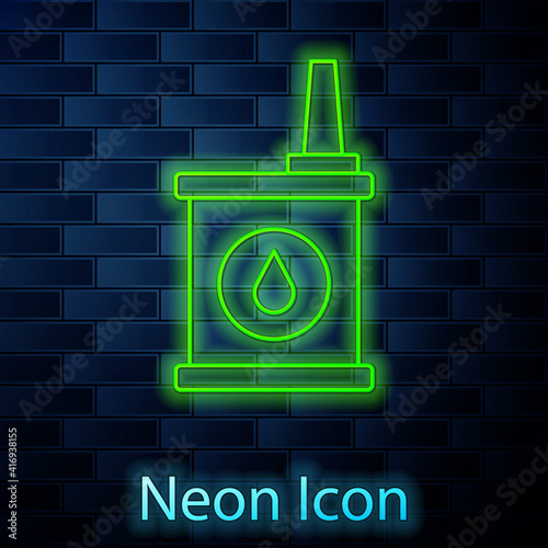Glowing neon line Canister for motor machine oil icon isolated on brick wall background. Oil gallon. Oil change service and repair. Vector.