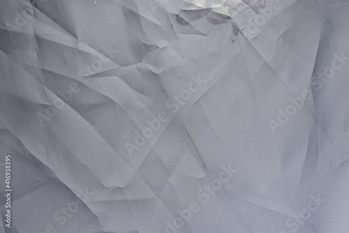 detail macro photo of crumpled truck tarpaulin.