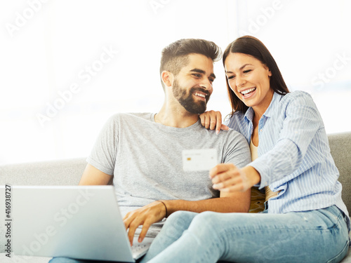young couple happy tablet together man woman shopping credit card buying order purchase online pay