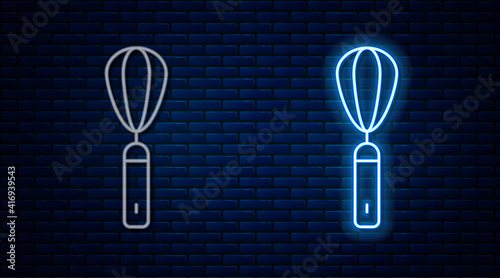 Glowing neon line Kitchen whisk icon isolated on brick wall background. Cooking utensil, egg beater. Cutlery sign. Food mix symbol. Vector.