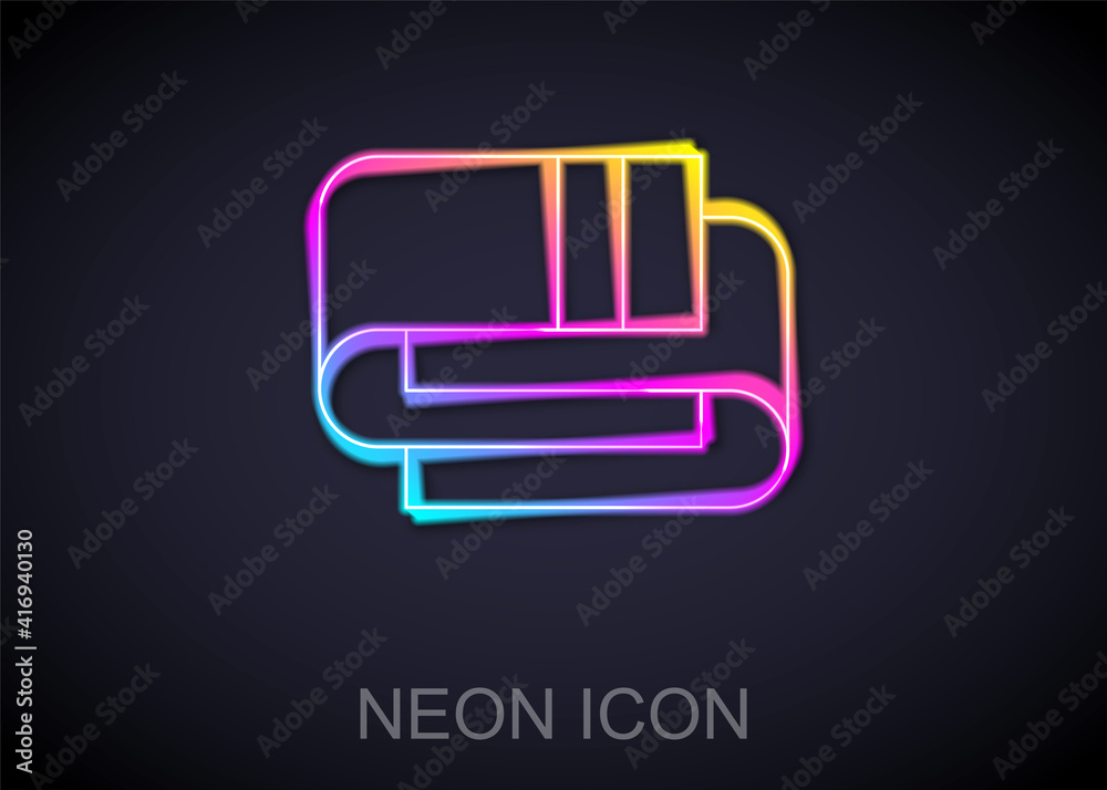 Glowing neon line Towel stack icon isolated on black background. Vector.
