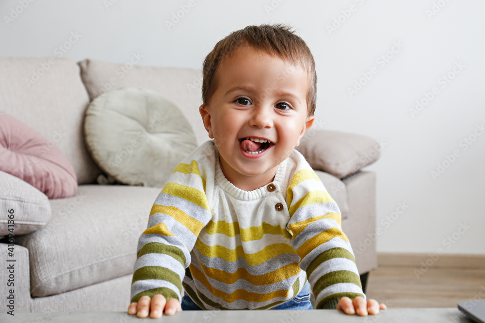 Portrait of adorable little boy having fun at home. Upset toddler throwing a tantrum at home. Cute toddler in a good mood, being playful. Close up, copy space, background. Portrait of adorable little boy having fun at home. Upset toddler throwing a tantrum at home. Cute toddler in a good mood, being playful. Close up, copy space, background.
