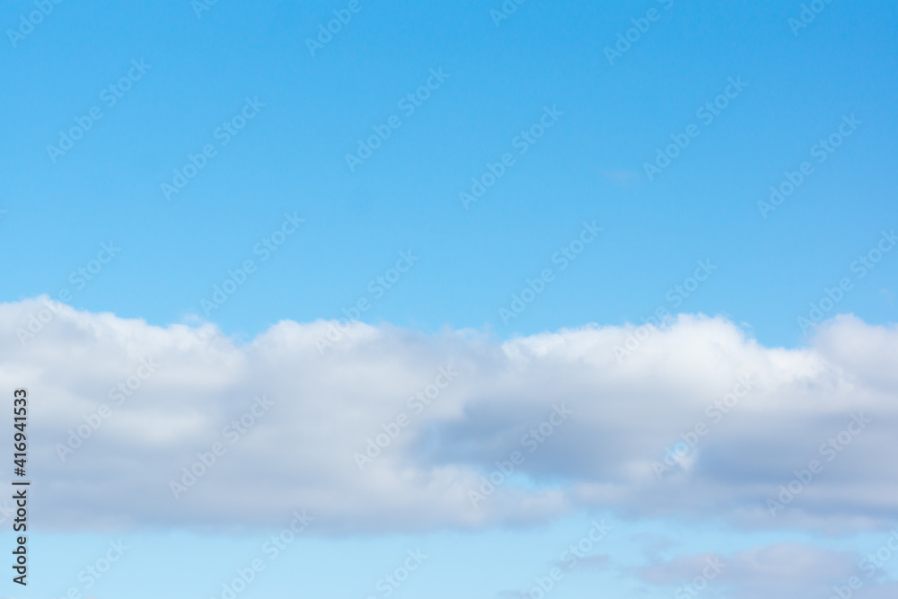 blue sky with light white clouds