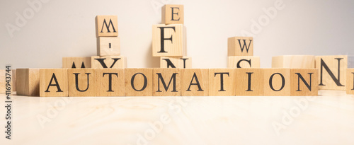 The word Automation is from wooden cubes. Background from wooden letters.