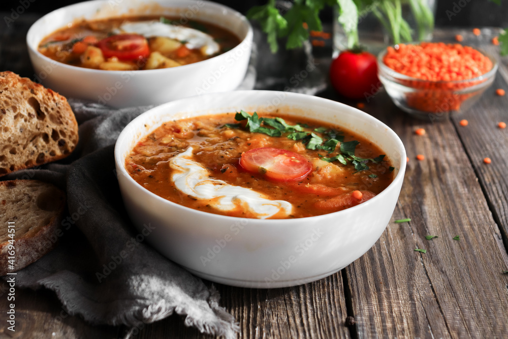 Soup with vegetables and red lentils. Vegan soup with beans and tomatoes. Soup with vegetables and red lentils. Vegan soup with beans and tomatoes.