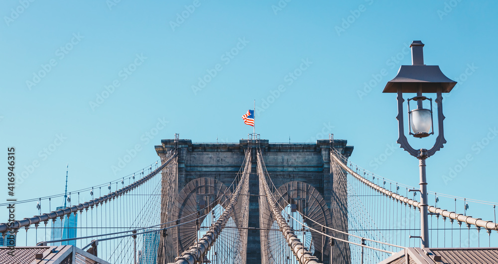 Fototapeta premium View from the pedestrian walkway of the Brooklyn Bridge. The Brooklyn Bridge is connects the boroughs of Manhattan and Brooklyn and is one of the biggest suspension bridge in the world.