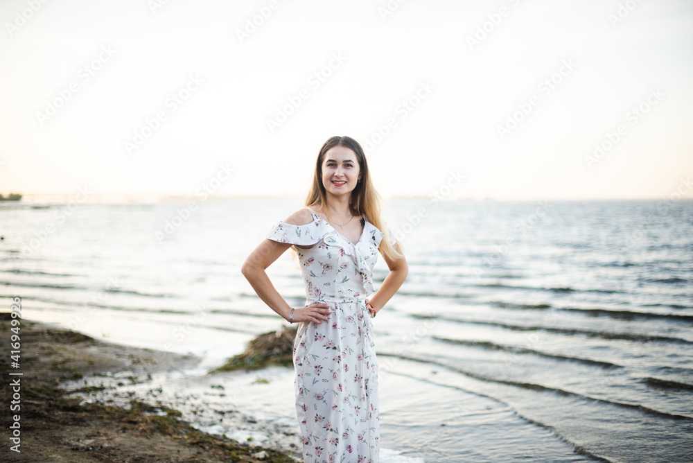 Blonde girl in summer light dress in summer outdoors Blonde girl in summer light dress in summer outdoors
