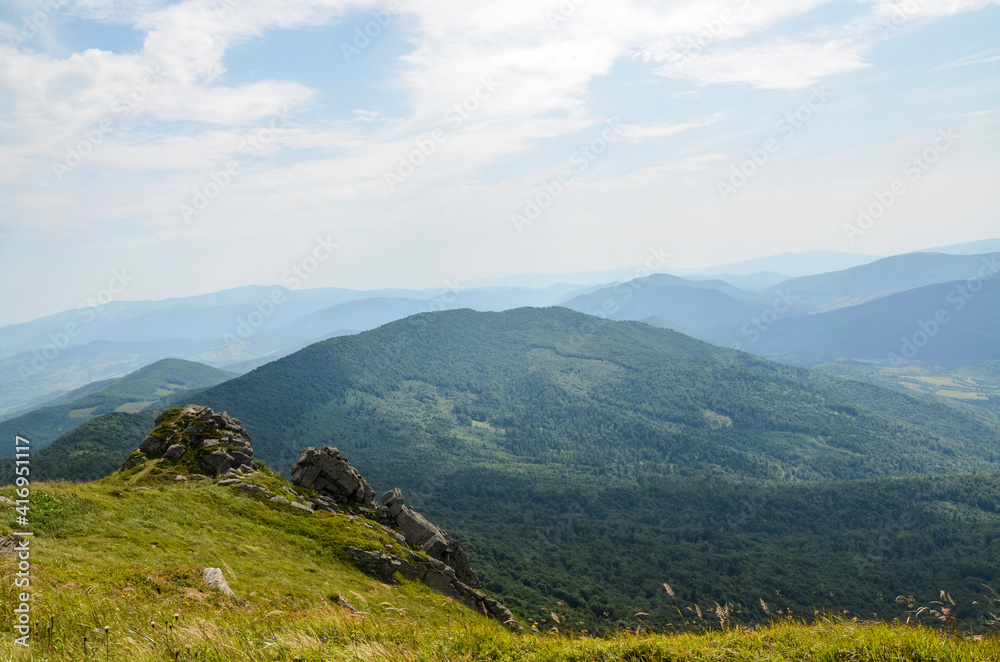 Beautiful mountain summer landscape with Carpathian hills and coniferous forest in Ukraine. Aerial panorama view from above. 