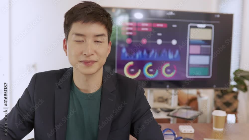 Slow motion of mature asian man employee wearing vr glasses moving arms gesturing enjoying cool device in office. Modern technology and fun concept.. Slow motion of mature asian man employee wearing vr glasses moving arms gesturing enjoying cool device in office. Modern technology and fun concept..