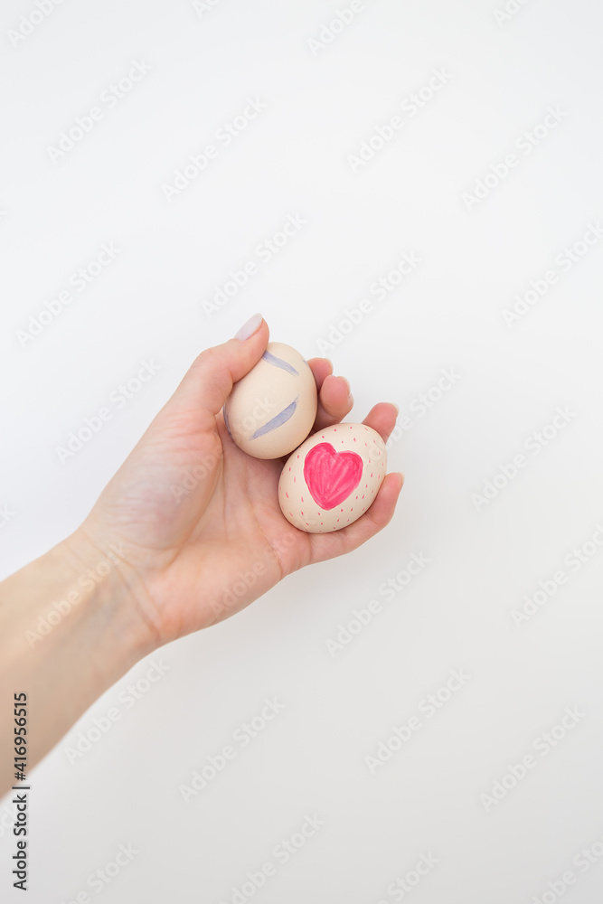 Girl holding Easter eggs painted with watercolors in hands, isolated on white background. Girl holding Easter eggs painted with watercolors in hands, isolated on white background.