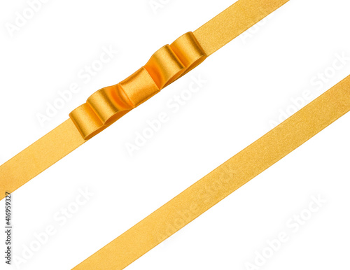 Festive golden gift ribbon and bow isolated on white background cutout