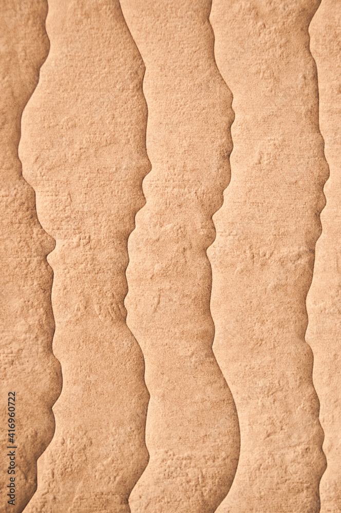 Fototapeta premium unusual background. Wavy stone look. Ungewöhnlicher Hintergrund. Wellenförmige Steinoptik