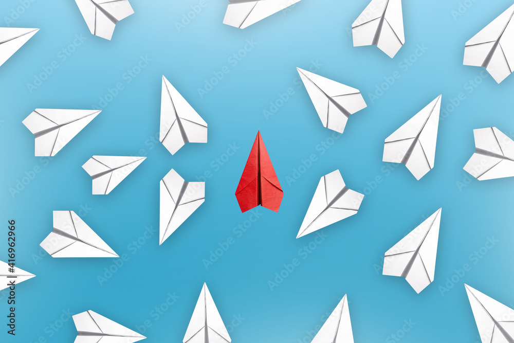 Red paper plane changing direction from white. new idea. Red paper plane changing direction from white. new idea.