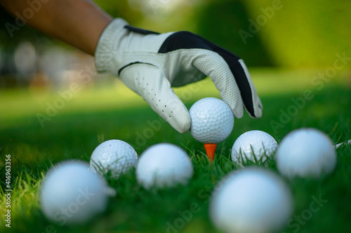 golfer putting on a course
