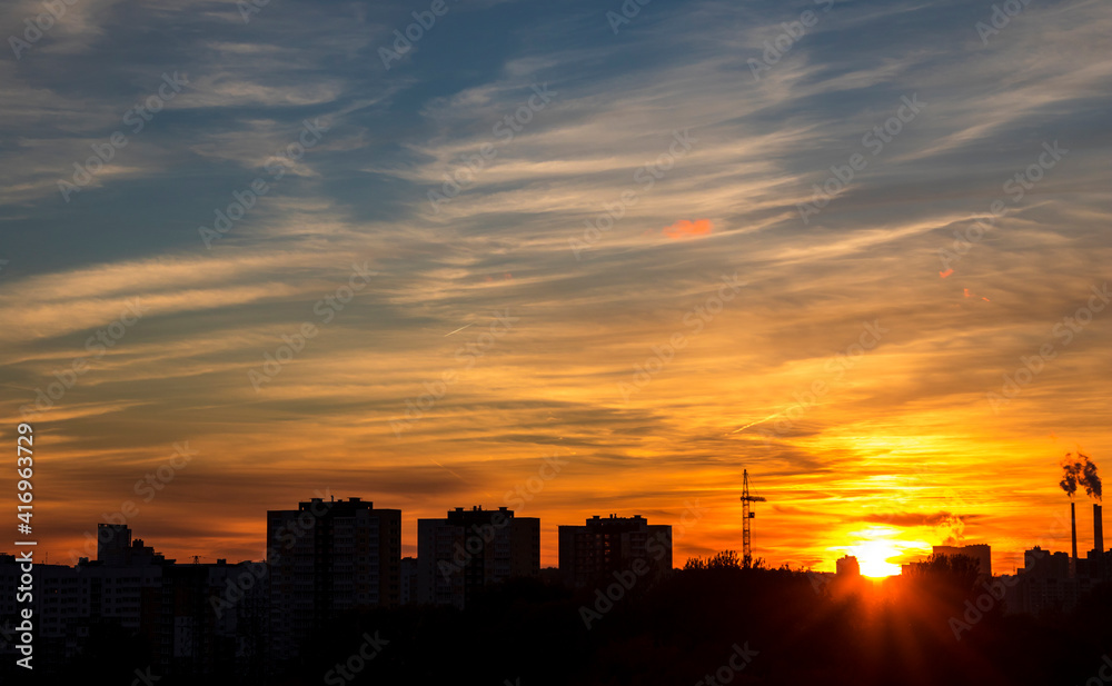 Townscape with clouds on sunset, nature background Townscape with clouds on sunset, nature background