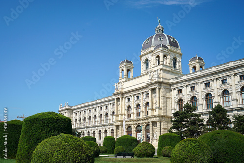 Beautiful architecture of famous Naturhistorisches Museum or Natural History Museum with beautiful garden and sculpture in Vienna, Austria.
