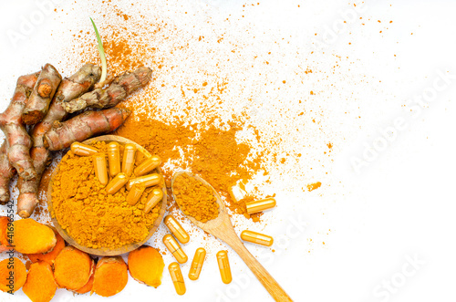 Obraz na plátně Organic curcumin or turmeric powder, capsule, and fresh root on white background
