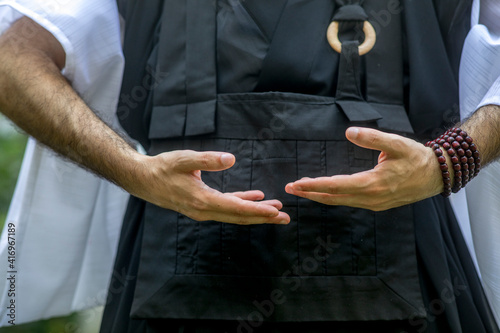 Zen sesshin (retreat) in Paris, France. Retreatant practising qi gong. 21.09.2018 photo