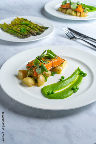 Fine dining Salmon and green pea puree 