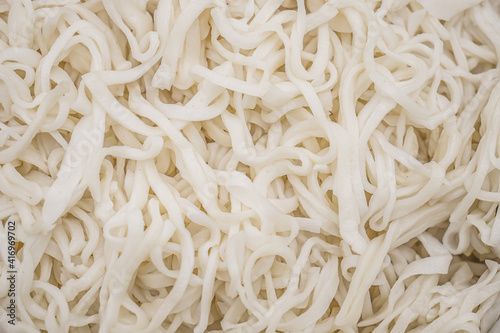 Boiled homemade noodles close-up as a background.
