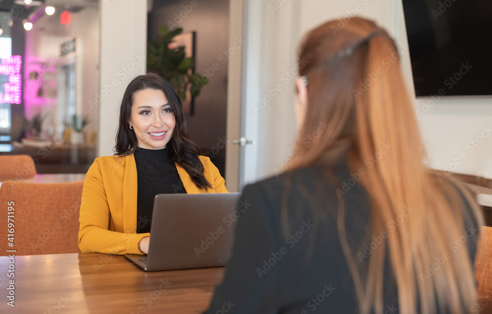 Two young business woman meeting Two young business woman meeting