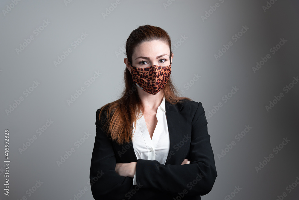 Fototapeta premium Pretty young business woman wearing protective mask. 