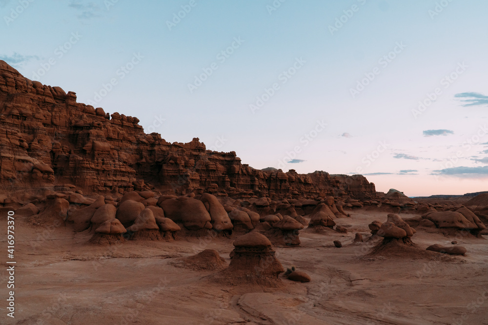 Mushroom rocks in Goblin Valley state park during sunrise. Mushroom rocks in Goblin Valley state park during sunrise.