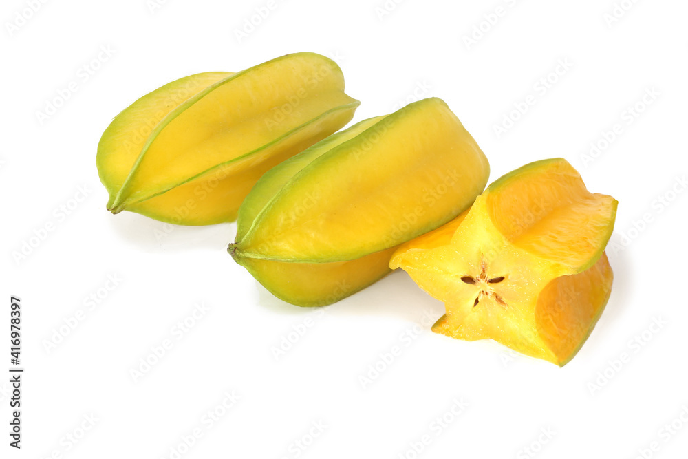 Two ripe averrhoa carambola and half isolated on white