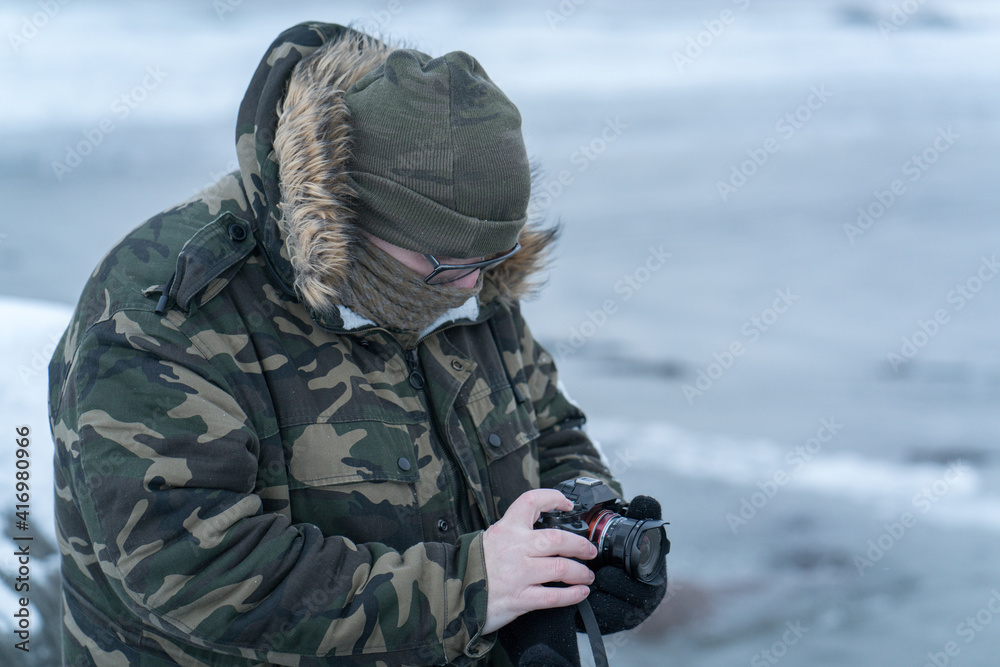 Man in winter walking in winter snow natural park Man in winter walking in winter snow natural park
