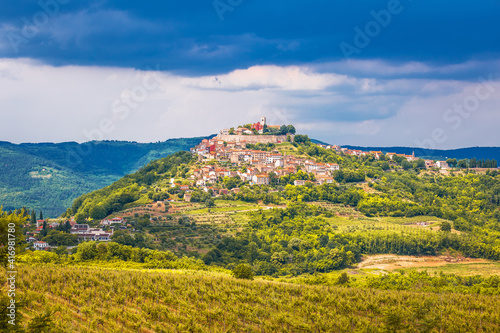 Historic town of Motovun on green hill view