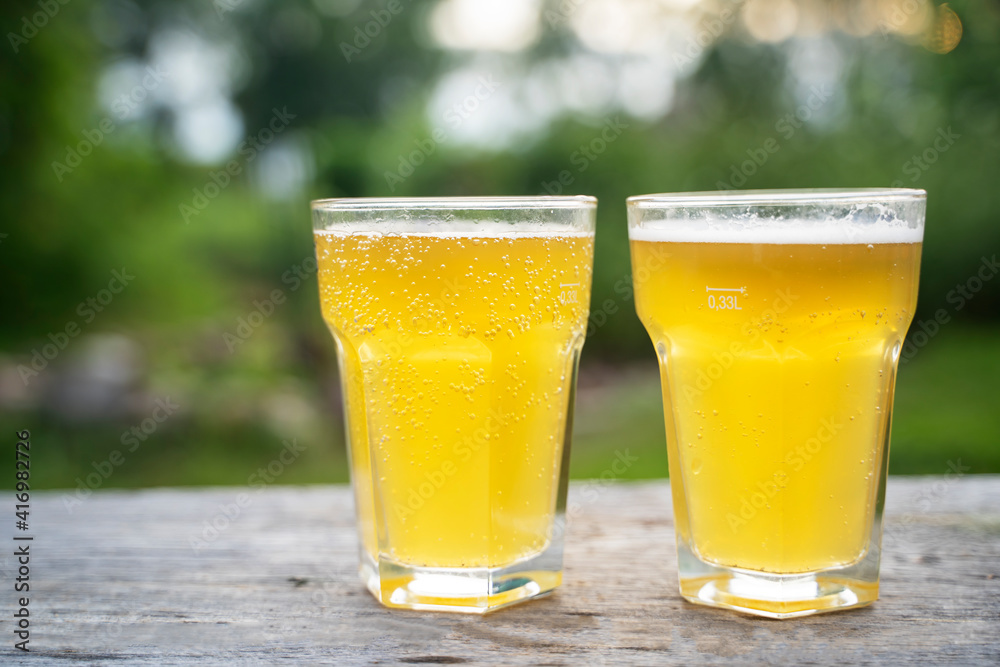 glass of beer on a wooden background in nature glass of beer on a wooden background in nature