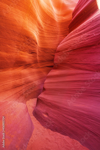 Beautiful red and orange sandstone wall with warm subtle light glow inside Antelope Canyon, Arizona, America