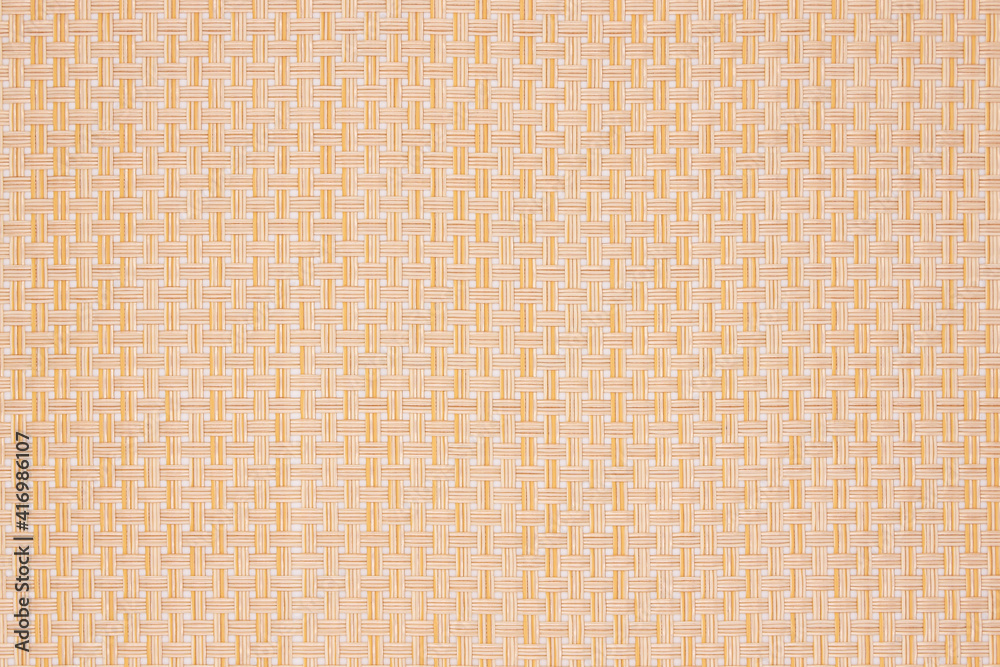 Background of a wicker plastic stand for hot dishes