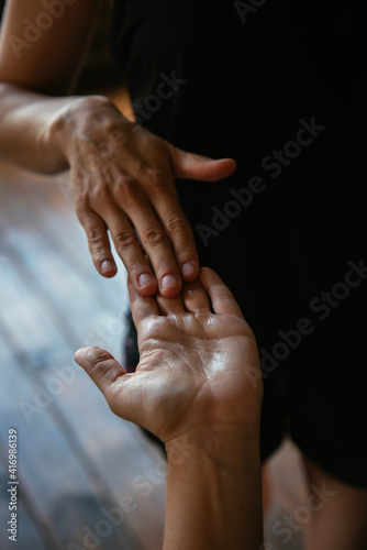 massage of female hands. oil on hands. vertical