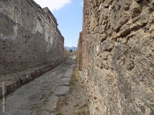 Pompei Roman Road and Street Ruins Italy Showing the Construction Methods of the Roman City Preserve by the Mount Vesuvius Eruption photo