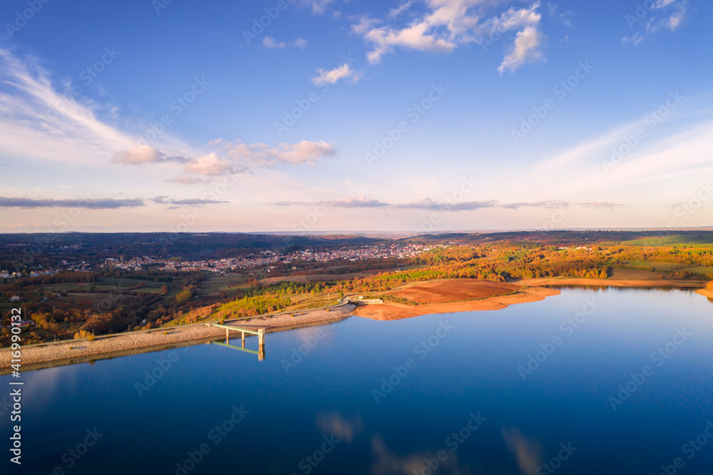Drone aerial panoramic view of Sabugal Dam lake reservoir with perfect reflection, in Portugal