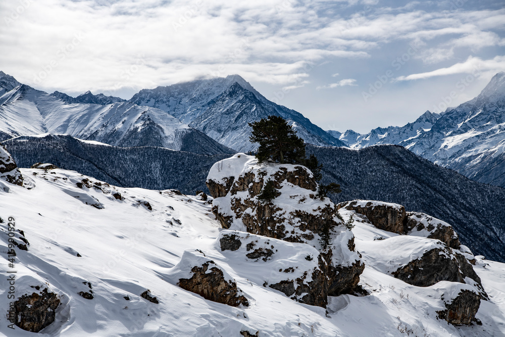 panoramic views of the snow-capped white mountains and bright blue sky 