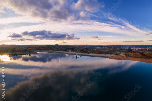 Drone aerial panoramic view of Sabugal Dam lake reservoir with perfect reflection  in Portugal