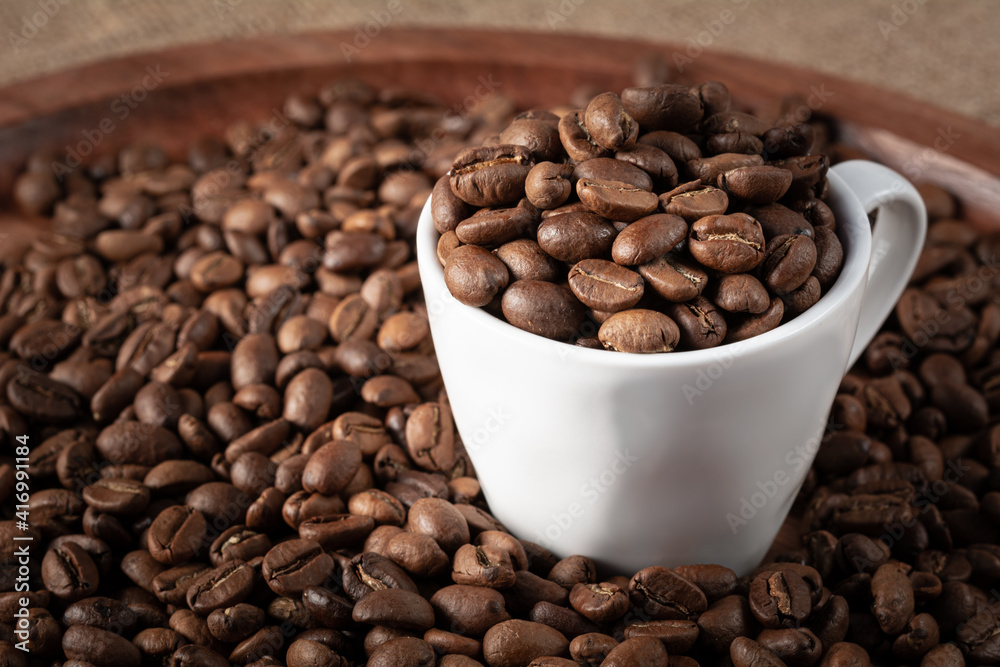 Coffee cup with roasted beans with copy space for your text Coffee cup with roasted beans with copy space for your text