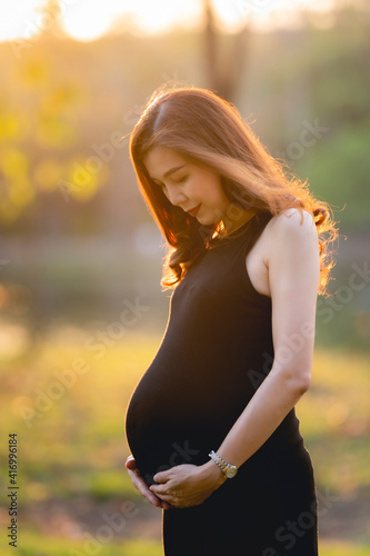 pregnant woman in natural park portrait.