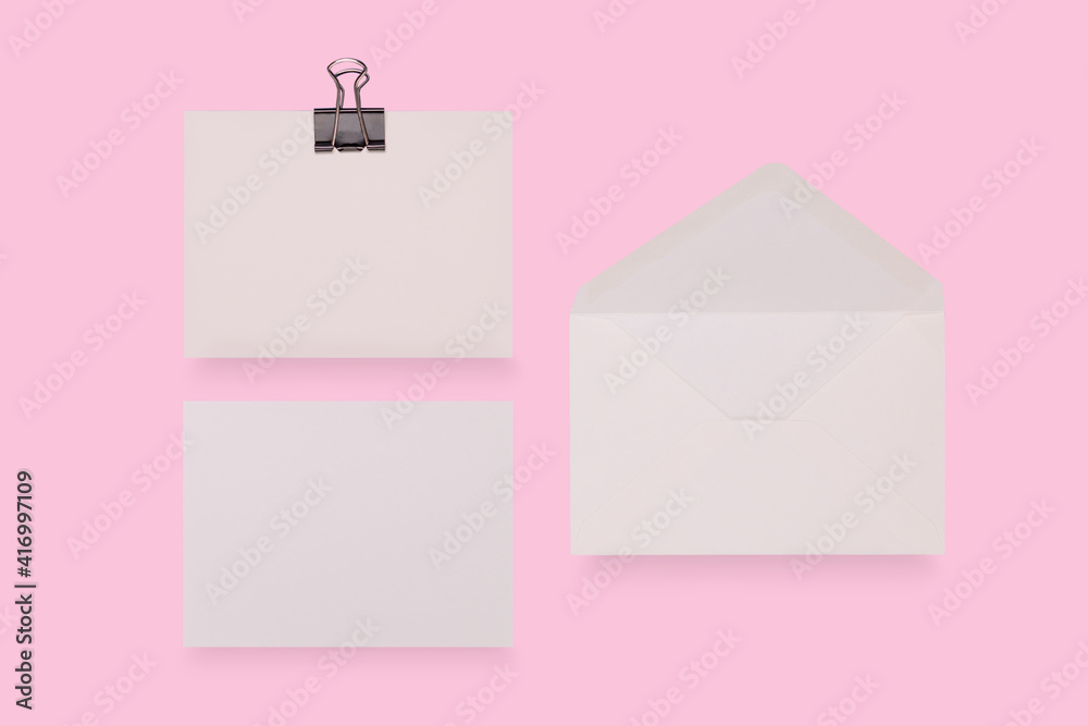 Simple small envelope with space for writing on a colourful pink background. close-up. Flat lay. Holiday and best wishes concept. Simple small envelope with space for writing on a colourful pink background. close-up. Flat lay. Holiday and best wishes concept.
